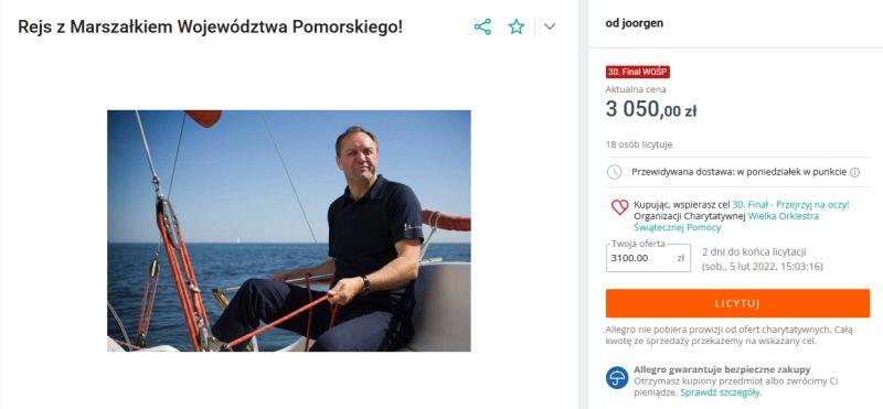 screen ze strony portalu aukcyjnego ze zdjęciem marszałka na żaglówce i kwotą