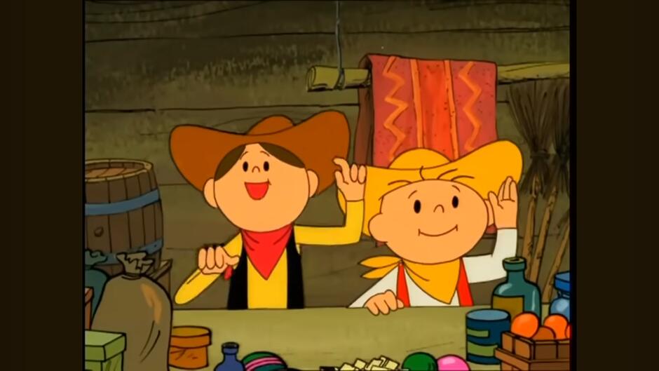 Kadr z rysunkowego filmu dla dzieci Bolek i Lolek . Dwóch chłopców w kapeluszach kowbojskich i apaszkach podnosi ręce i śmieje się w sklepie.