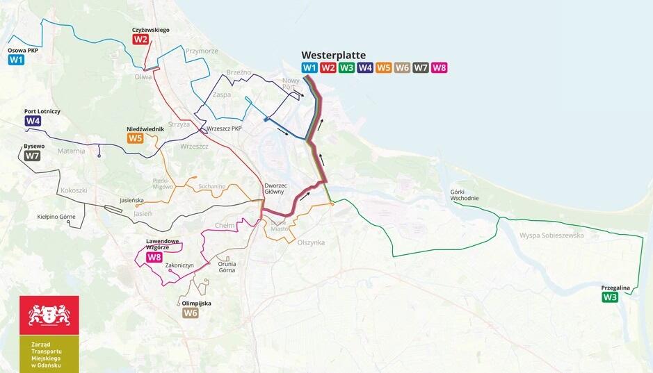 Na zdjęciu przedstawiona jest mapa transportu publicznego w Gdańsku, pokazująca różne trasy autobusowe oznaczone kolorami i numerami, prowadzące na Westerplatte