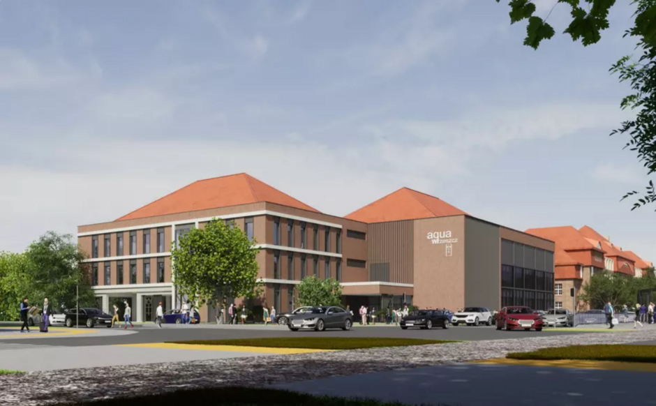 na zdjęciu niewysoki budynek o brązowej elewacji i spadzistych dachach