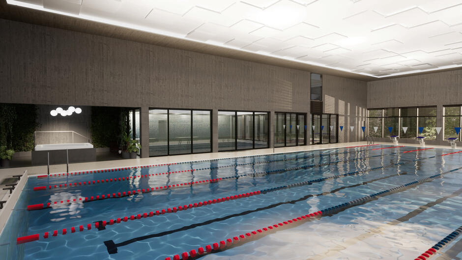 Przestronna hala basenowa z torami pływackimi zaprojektowana jest z myślą o profesjonalnym treningu i zawodach. W tle widać przeszklone ściany i jacuzzi otoczone zielenią.