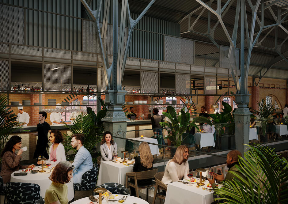 Na wizualizacji przedstawiono elegancką restaurację wewnątrz Hali Targowej w Gdańsku, gdzie goście siedzą przy nakrytych białymi obrusami stolikach. Nowoczesny wystrój z zielenią i otwartą kuchnią harmonizuje z industrialną, zabytkową konstrukcją hali.
