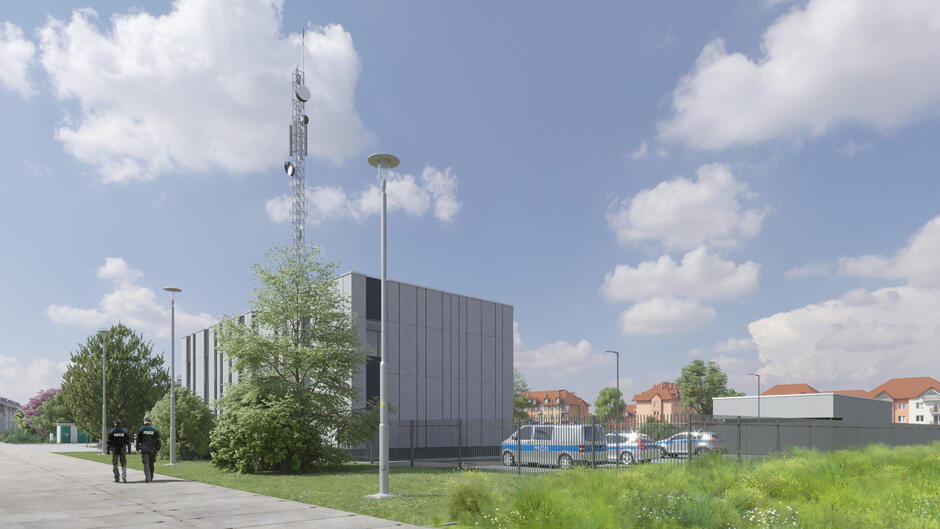 wizualizacja, przedstawia betonowy budynek w tle, przed nim zielony teren