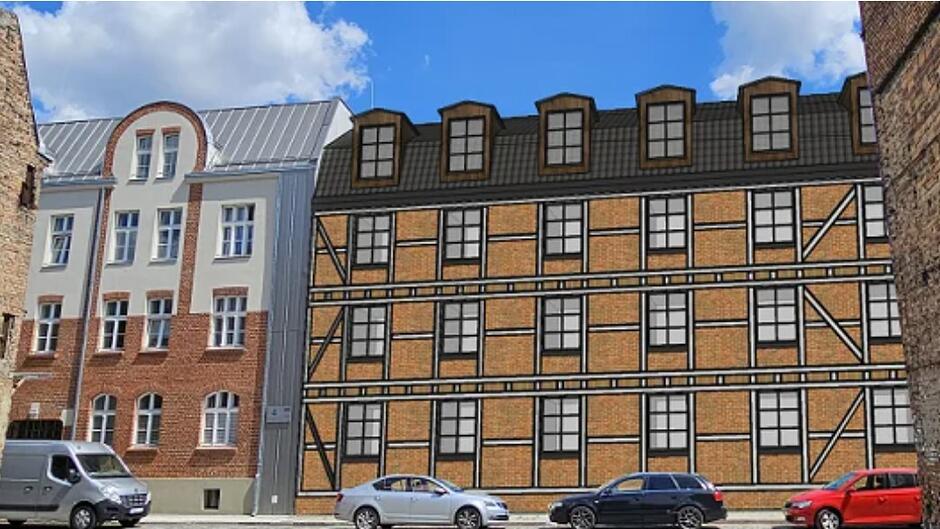 budynek brązowo-kremowy z oknami na pierwszym planie. Pod nim stoją zaparkowane samochody