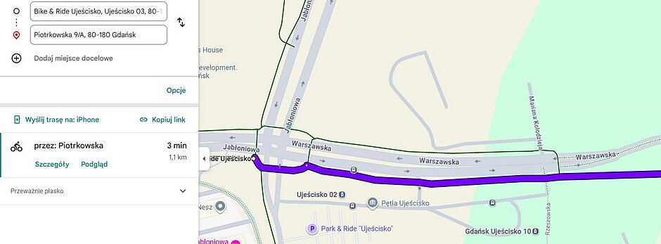 Obraz przedstawia zrzut ekranu z Map Google, na którym wyznaczono trasę rowerową o długości 1,1 km z punktu Bike & Ride Ujeścisko do adresu Piotrkowska 9/A w Gdańsku. Fioletowa linia na mapie prowadzi wzdłuż ulicy Warszawskiej, a szacowany czas przejazdu wynosi 3 minuty po przeważnie płaskim terenie.