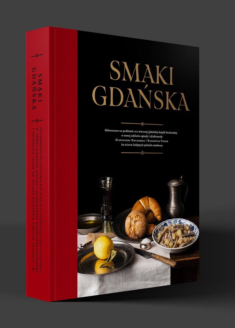 Zdjęcie przedstawia książkę smaki gdańska stojącą na stole